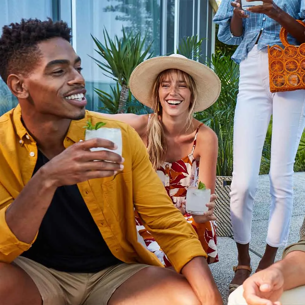 Group of people enjoying the Cruzan Mai Tai cocktail outside.