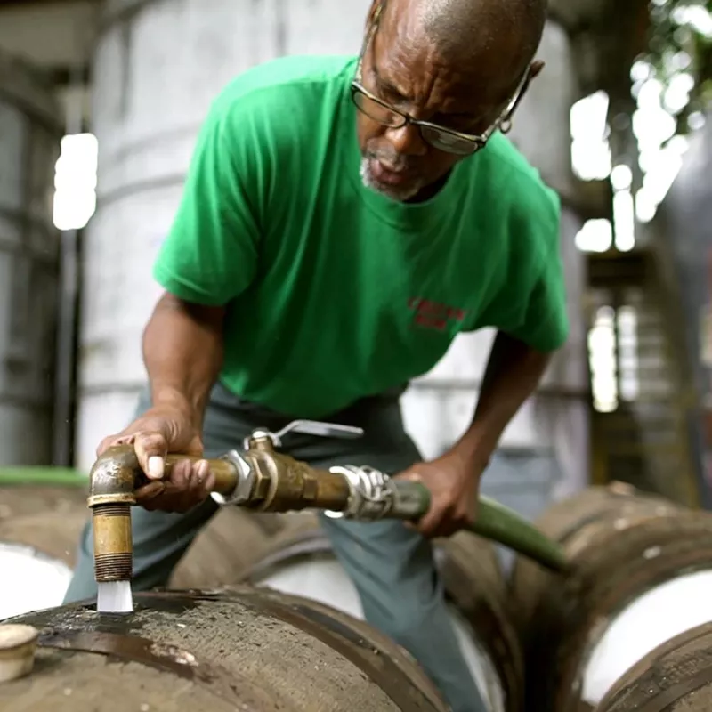 Cruzan® employee preparing oak barrels and casks to make Cruzan® Rum.