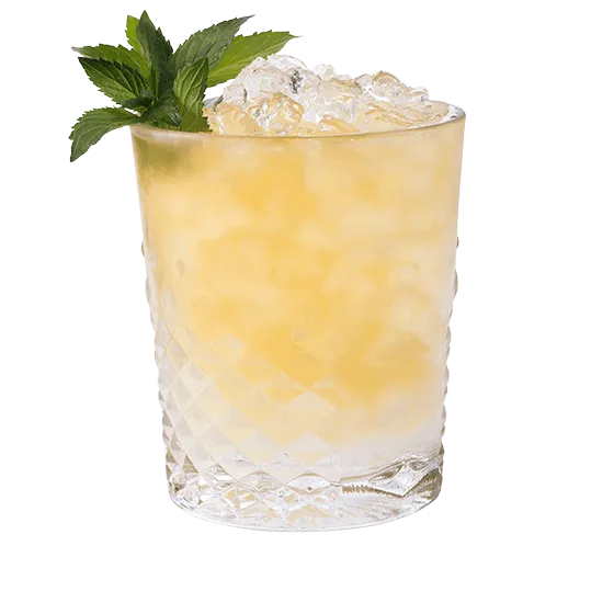 Key Lime Pie cocktail in a glass, garnished with mint.