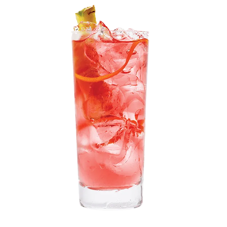 Passion Punch in a tall glass, garnished with pineapple and an orange rind.