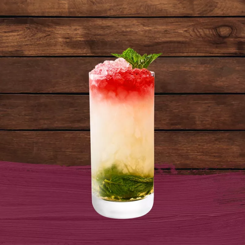 Queen's Park Swizzle Cocktail in a Collins glass with a red, white and green layered look set against a wood background with a dark red paint swash.