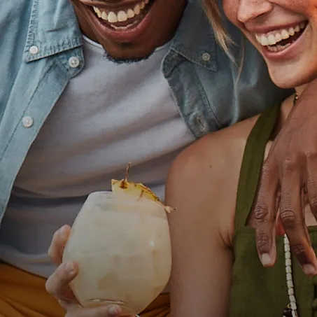 Group of people enjoying Cruzan rum drinks and rum cocktails