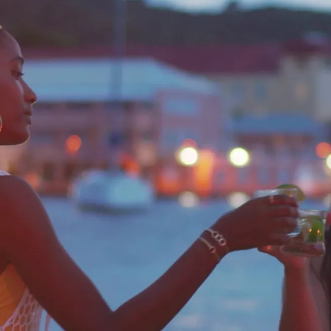 A group of people enjoying rum in mixed drinks.