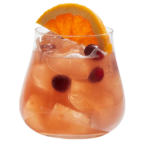 Cruzan® Island Breeze cocktail garnished with citrus fruit and cranberries in a short glass.
