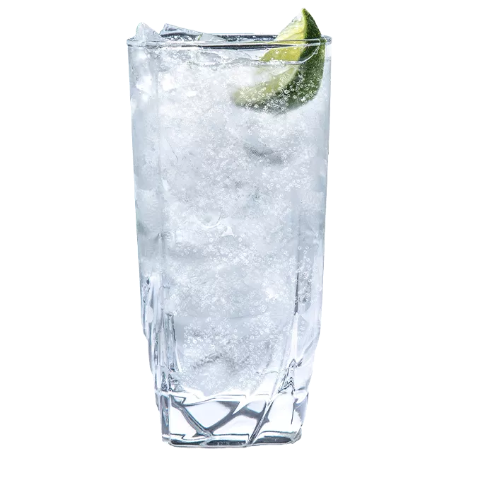 Cruzan® Aged Light & Tonic made with Cruzan® Aged Light Rum in a tall, clear glass garnished with a lime wedge.
