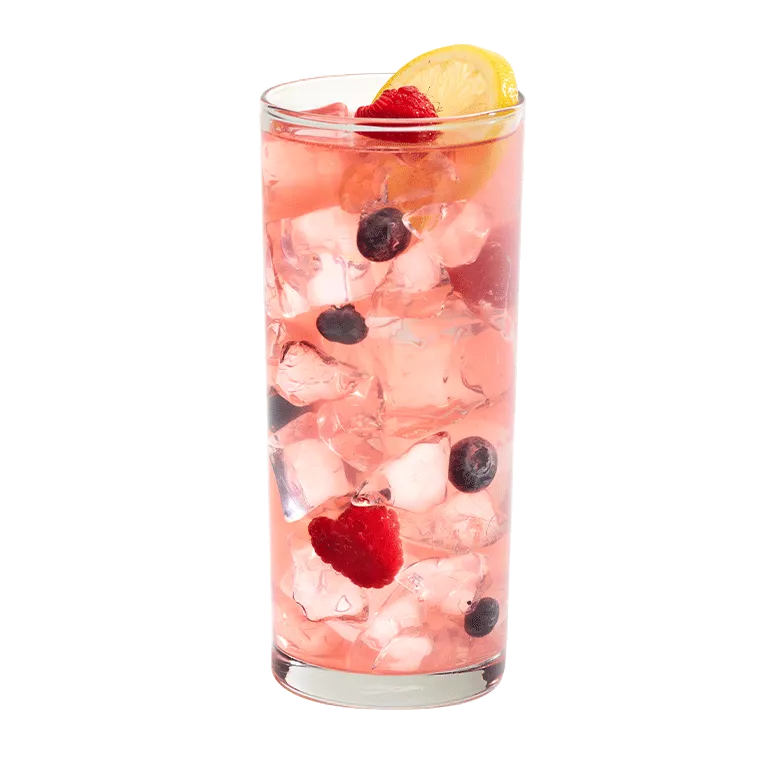 Cruzan® Blue Velvet cocktail in a clear glass garnished with berries and a lemon.
