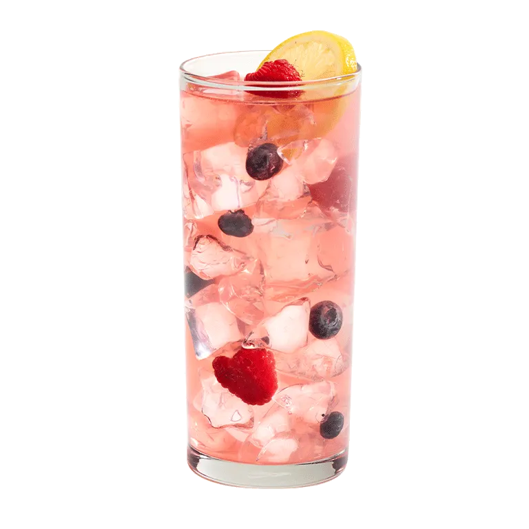 Cruzan® Blue Velvet cocktail in a clear glass garnished with berries and a lemon.