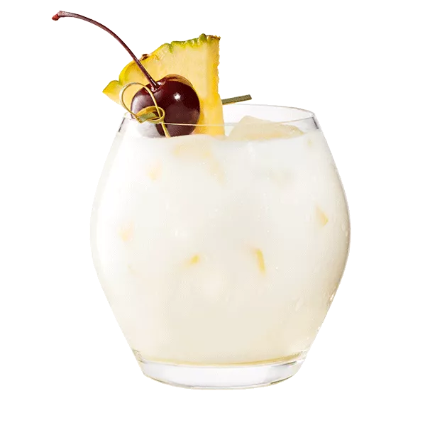 Cruzan® Piña Colada in a clear glass garnished with a cherry and pineapple.