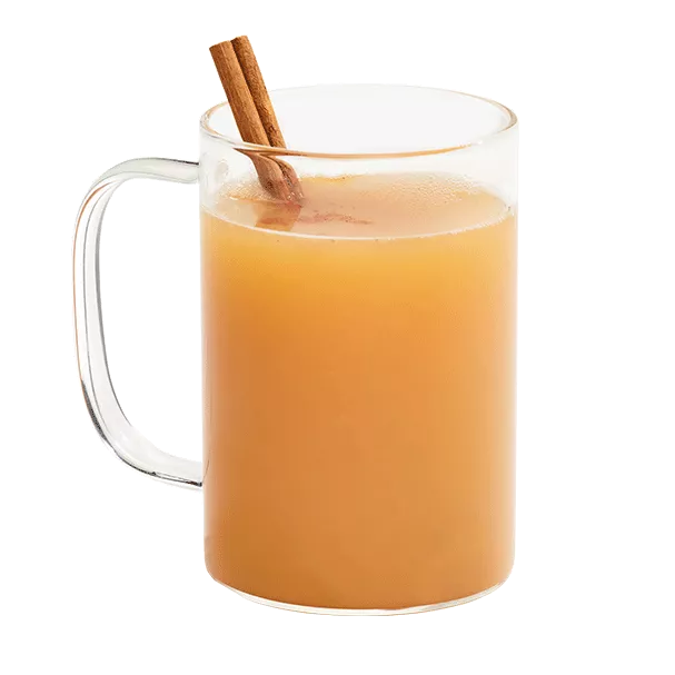 Hot apple cider mixed with Cruzan® Island Spiced Rum in a clear mug garnished with a cinnamon stick.