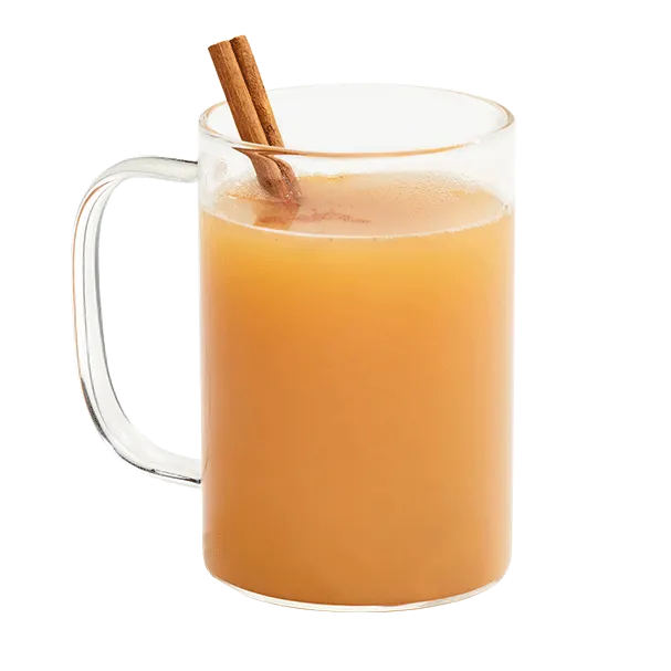 Hot apple cider mixed with Cruzan® Island Spiced Rum in a clear mug garnished with a cinnamon stick.