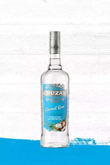 Clear glass Cruzan Coconut Rum bottle against a whitewashed wood background with a light blue paint swash.