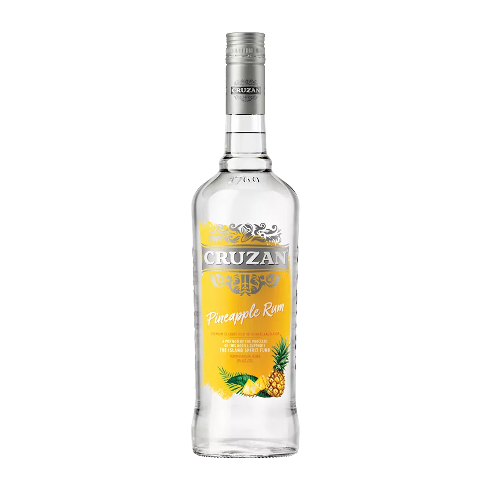 Clear bottle of Cruzan Pineapple Rum with a yellow label decorated with pineapples.
