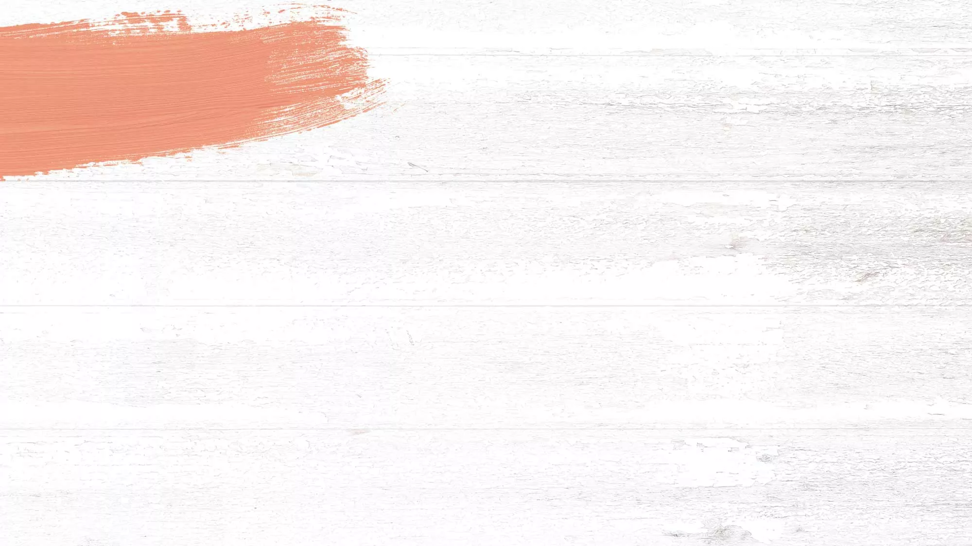 Whitewashed wood background with a peach hued paint swash.