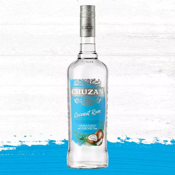 Glass bottle of Cruzan Coconut Rum against a background of light oak barrel panels and a turquoise paint smudge.