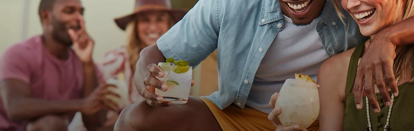 Group of people enjoying Cruzan rum drinks and rum cocktails