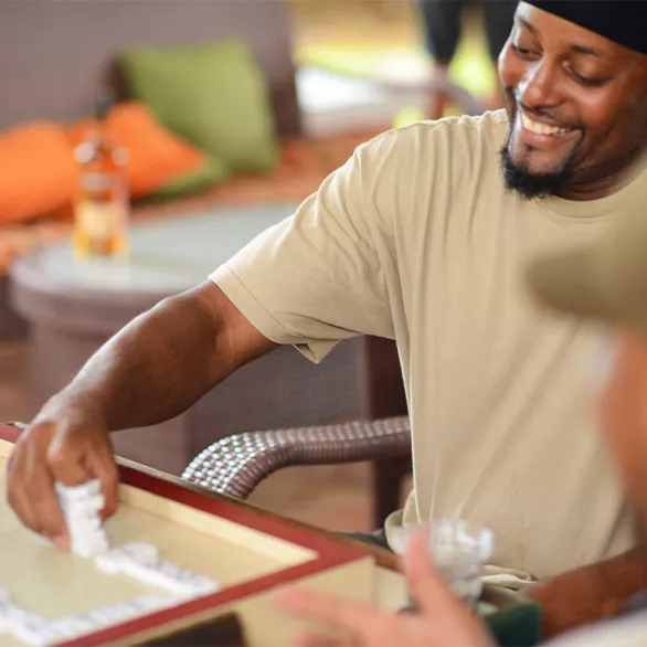 A man playing dominos in St. Croix.