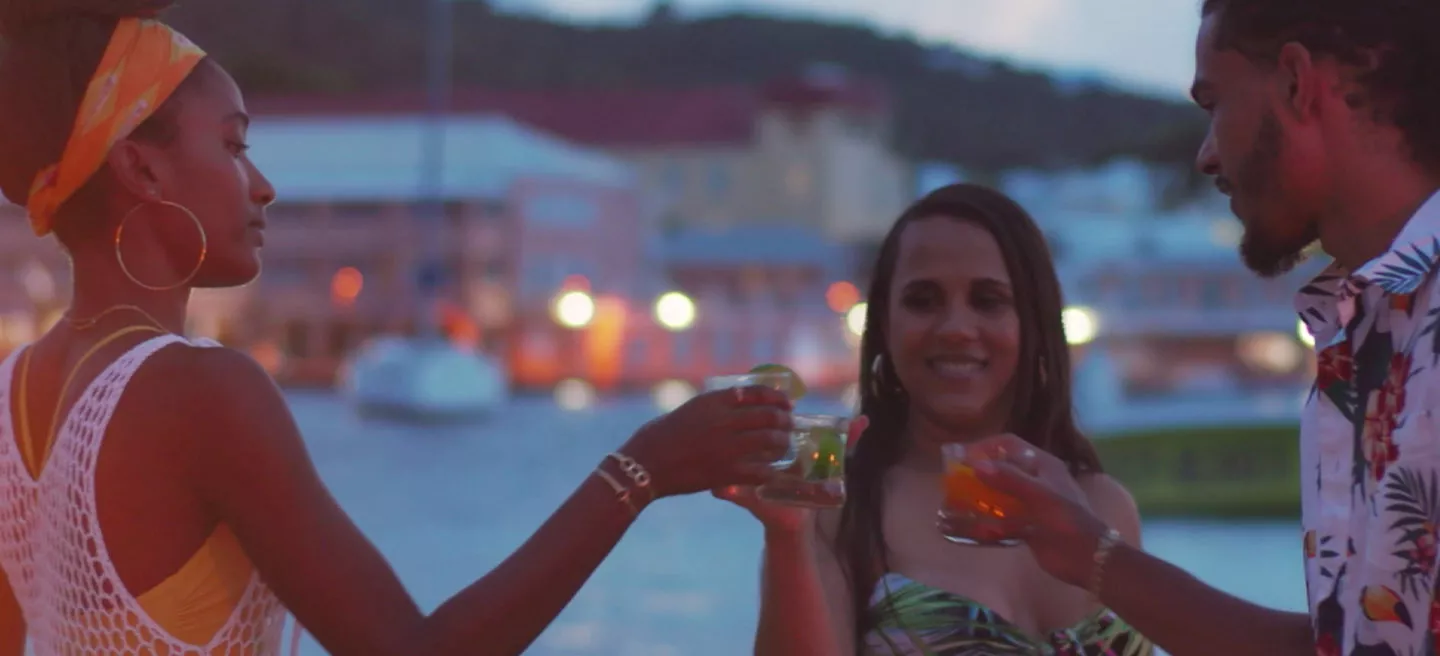 A group of people enjoying rum in mixed drinks.