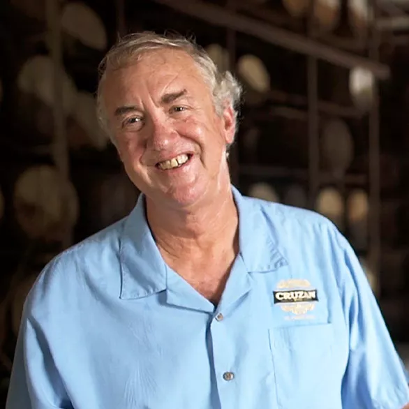 Donnie Nelthropp wearing a blue Cruzan Rum distillery shirt.