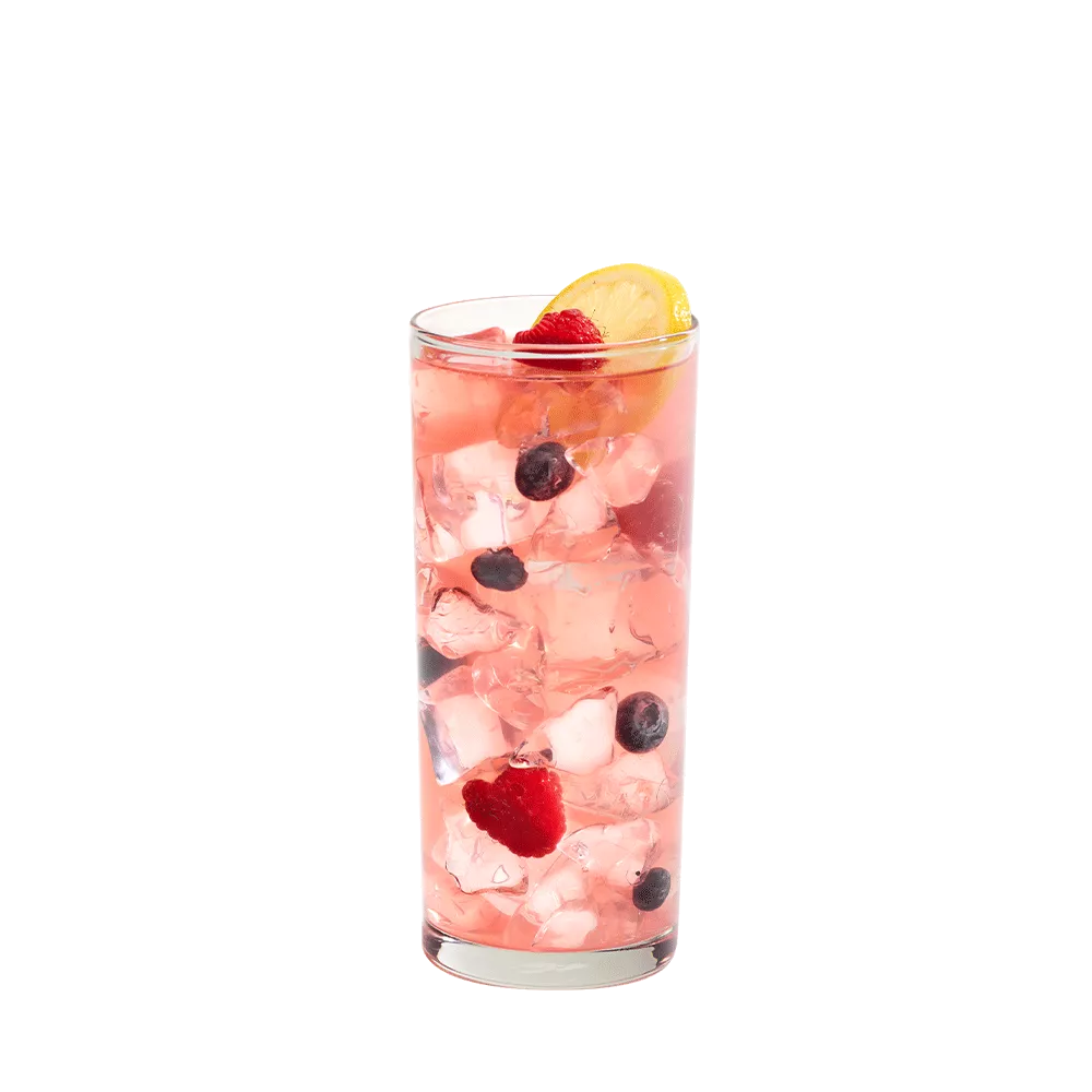 Cruzan® Blue Velvet cocktail in a clear glass garnished with berries and a lemon.