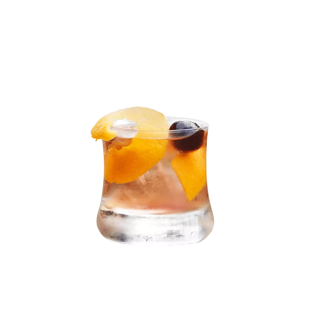 Cruzan® Morning cocktail, a light rum drink, in a rocks glass garnished with an orange peel and a black cherry.